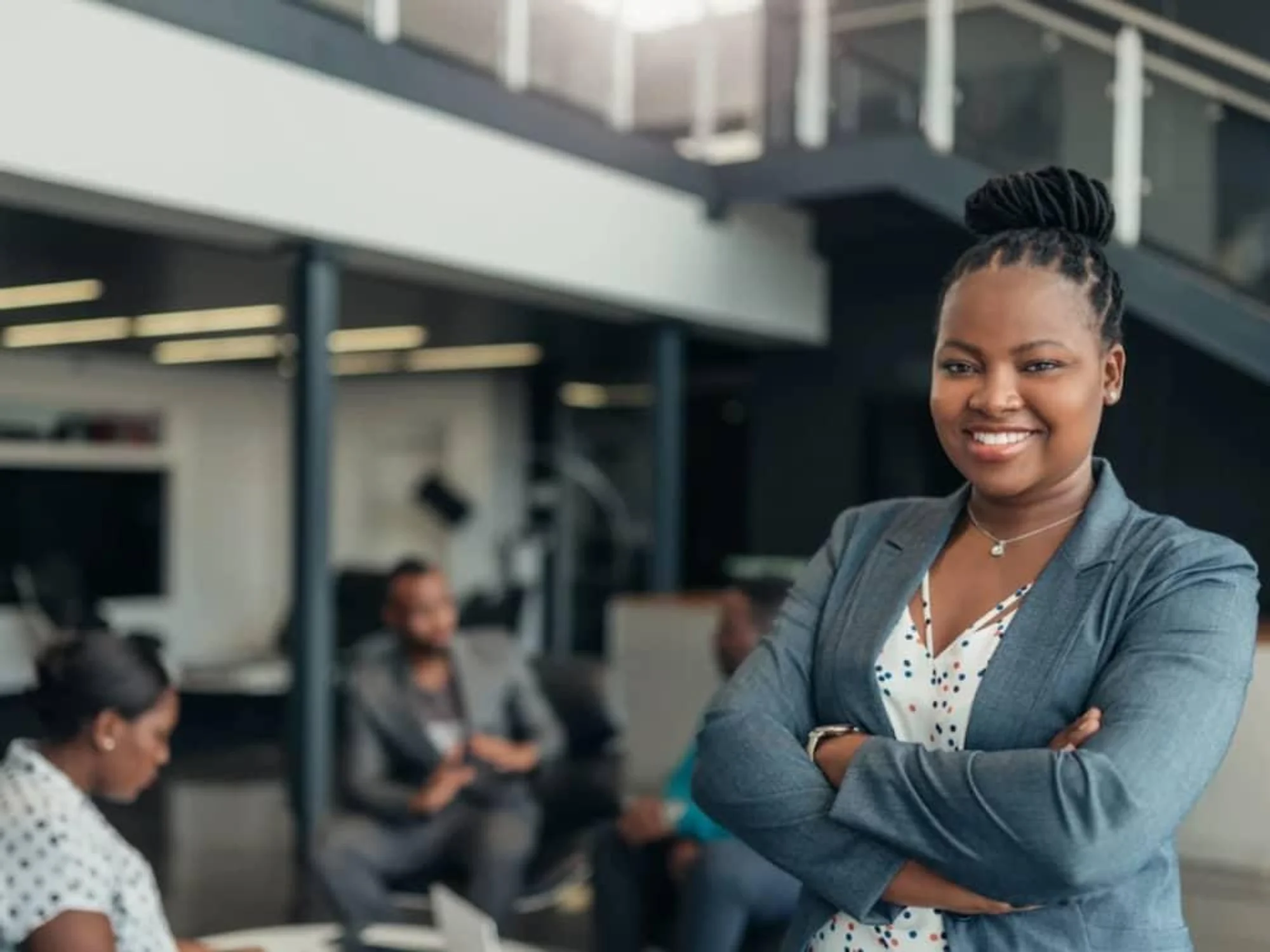 Black woman standing arms folded